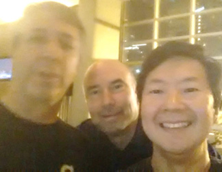 Pete and his colleague Dr. Lefton discussing humor in education with Dr. Ken Jeong over drinks in Atlanta.