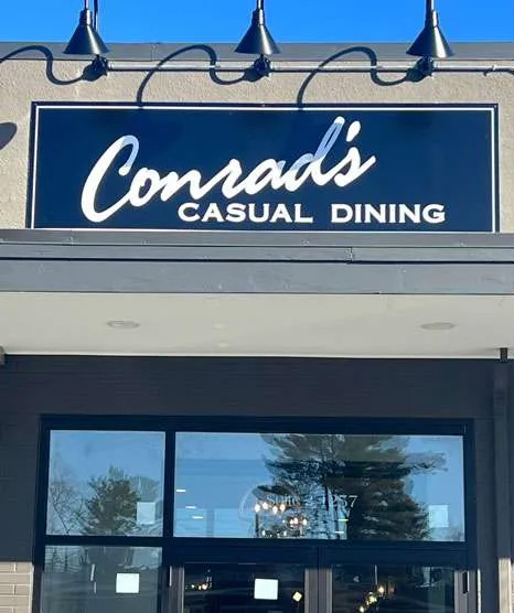 Sign for Conrad's Casual Dining restaurant.